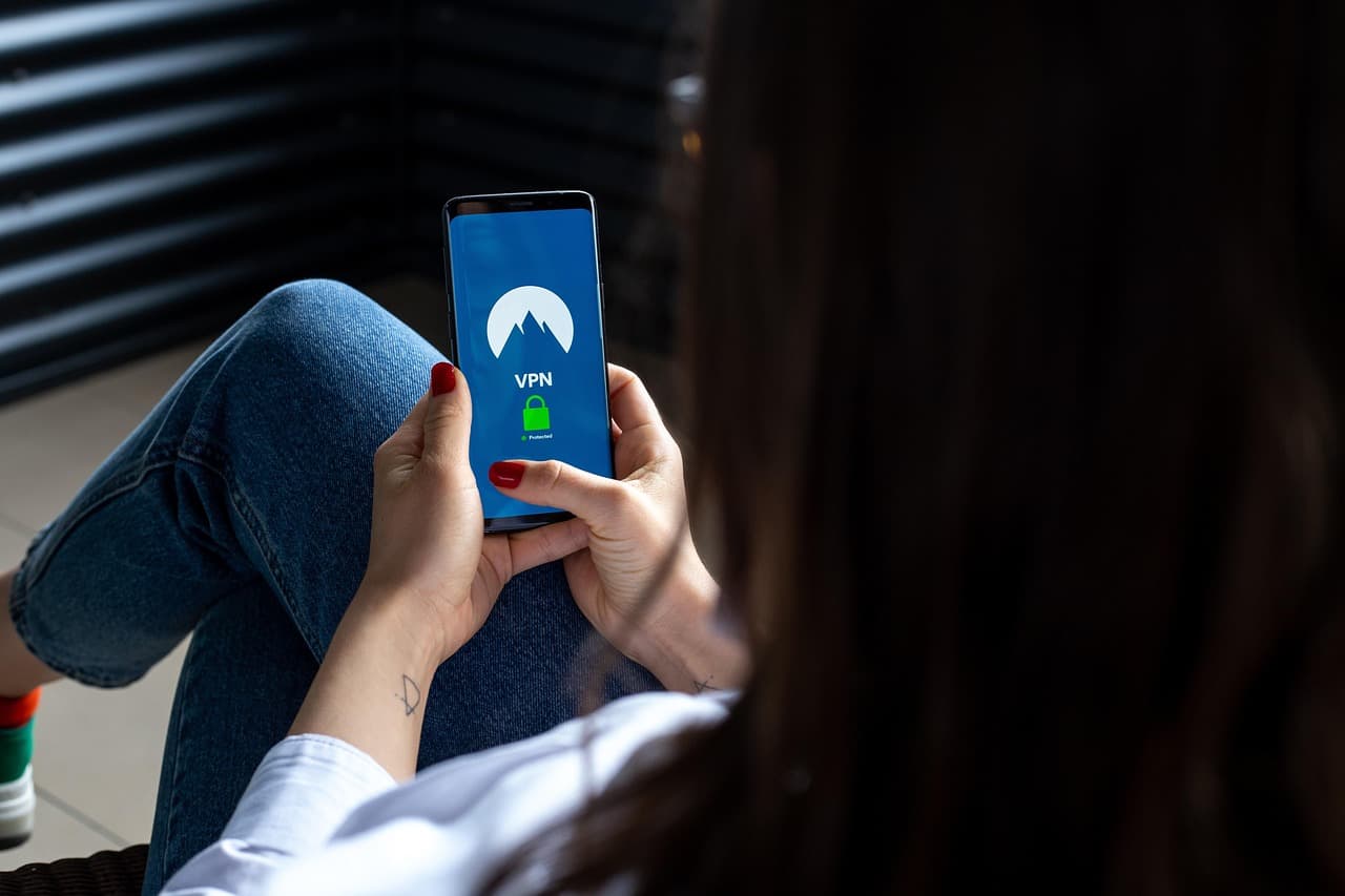 A person using a VPN app on a smartphone